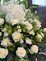 Reflower HK elegant sympathy flower stand featuring a white hydrangea, white roses, and green chrysanthemums, designed for funeral homes and memorial services to express deepest condolences.