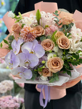 Reflower HK elegant mixed bouquet featuring purple Phalaenopsis orchids, peach roses, and dahlias, wrapped in peach paper with a lavender ribbon, perfect for Mother's Day and elder birthdays.