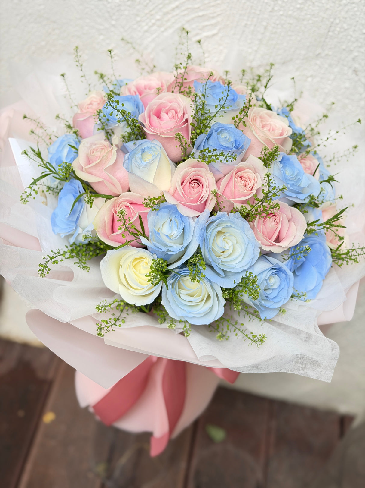Reflower HK dreamy pastel bouquet featuring 36 ice blue and pink roses with green bell, beautifully wrapped in pink paper and wavy organza, perfect for proposals and anniversaries.