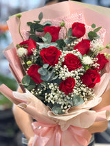 Reflower HK elegant romantic bouquet featuring 10 premium red roses and baby's breath, uniquely wrapped in soft pink frosted paper and wavy organza, symbolizing perfect love.
